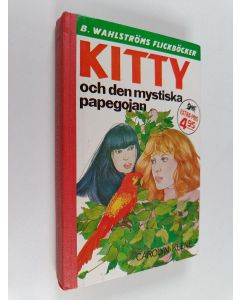Kirjailijan Carolyn Keene käytetty kirja Kitty och den mystiska papegojan