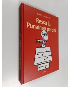 Kirjailijan Charles M. Schulz käytetty kirja Ressu ja Punainen Paroni