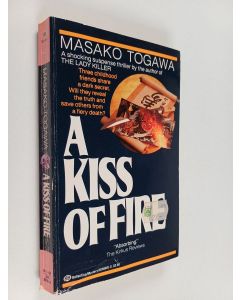Kirjailijan Masako Togawa käytetty kirja A Kiss of Fire