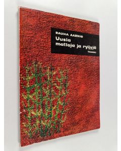 Kirjailijan Rauha Aarnio käytetty kirja Uusia mattoja ja ryijyjä : 23 mallia työohjeineen
