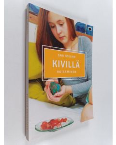 Kirjailijan Sari McGlinn käytetty kirja Kivillä hoitaminen