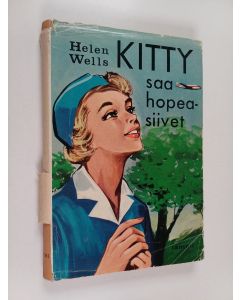 Kirjailijan Helen Wells käytetty kirja Kitty saa hopeasiivet
