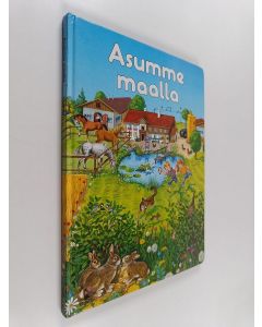 Kirjailijan Gisela Fischer käytetty kirja Asumme maalla