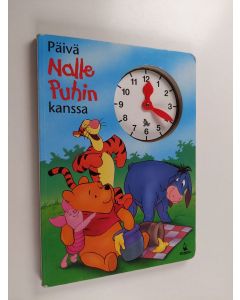 Kirjailijan Patricia Mennen käytetty kirja Päivä Nalle Puhin kanssa