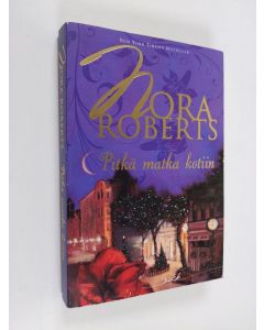 Kirjailijan Nora Roberts käytetty kirja Pitkä matka kotiin