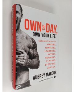 Kirjailijan Aubrey Marcus käytetty kirja Own the day, own your life : optimized practices for waking, working, learning, eating, training, playing, sleeping, and sex