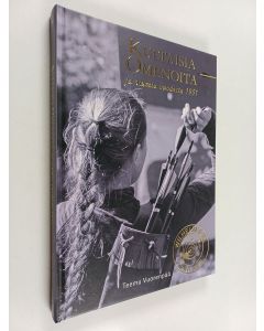Kirjailijan Teemu Vuorenpää käytetty kirja Kultaisia omenoita ja osumia vuodesta 1951 : Jousiammuntaseura Wilhelm Tell 1951-2021