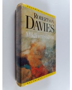 Kirjailijan Robertson Davies käytetty kirja Mikä verissä on