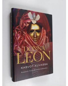 Kirjailijan Donna Leon käytetty kirja Kasvot kuvassa : komisario Guido Brunettin tutkimuksia