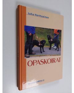 Kirjailijan Juha Herttuainen käytetty kirja Opaskoirat