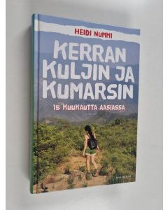 Kirjailijan Heidi Nummi käytetty kirja Kerran kuljin ja kumarsin : 15 kuukautta Aasiassa