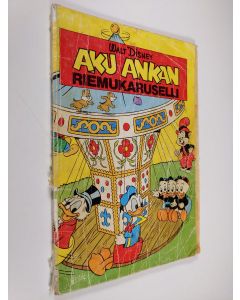 Kirjailijan Walt Disney käytetty kirja Aku Ankan riemukaruselli