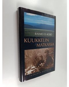 Kirjailijan Raimo O. Kojo käytetty kirja Kuukkelin matkassa : Inarista Hettaan 1955-1999