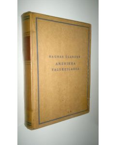 Kirjailijan Ragnar Ölander käytetty kirja Amerikka valokeilassa : vaikutelmia matkalta nykypäivien USA:ssa
