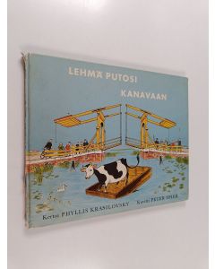 Kirjailijan Phyllis Krasilovsky käytetty kirja Lehmä putosi kanavaan