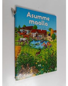 Kirjailijan Gisela Fischer käytetty kirja Asumme maalla