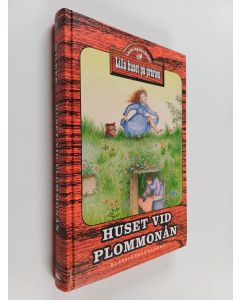 Kirjailijan Laura Ingalls Wilder käytetty kirja Huset vid Plommonån