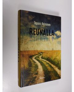 Kirjailijan Tapani Heinonen käytetty kirja Reunalla