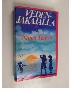 Kirjailijan Nancy Thayer käytetty kirja Vedenjakajalla
