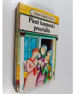 Kirjailijan Laura Ingalls Wilder käytetty kirja Pieni kaupunki preerialla