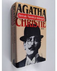 Kirjailijan Agatha Christie käytetty kirja Hercule Poirotin johtolangat - Viisi kuulua mysteeriä : Stylesin tapuas ; Idän pikajunan arvoitus ; Kortit pöydällä ; Kuolema Niilillä ; Esirippu