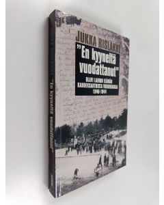 Kirjailijan Jukka Rislakki käytetty kirja En kyyneltä vuodattanut : olavi laihon elämän kahdeksantoista vuodenaikaa 1940-1944
