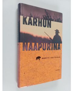 Kirjailijan Martti Peltomaa käytetty kirja Karhun naapurina : pyytötarinoita