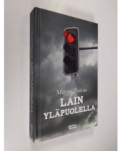 Kirjailijan Marja Toivio käytetty kirja Lain yläpuolella