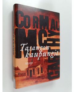 Kirjailijan Cormac McCarthy käytetty kirja Tasangon kaupungit