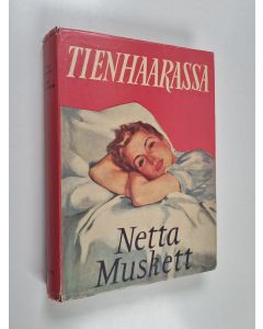 Kirjailijan Netta Muskett käytetty kirja Tienhaarassa