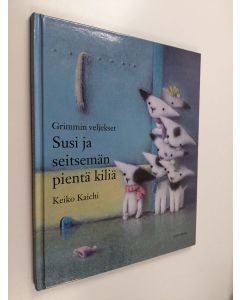 Kirjailijan Grimmin veljekset käytetty kirja Susi ja seitsemän pientä kiliä