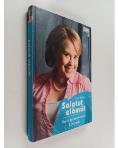 Kirjailijan Outi Ikonen käytetty kirja Salatut elämät Salla ja haaveiden kaupunki