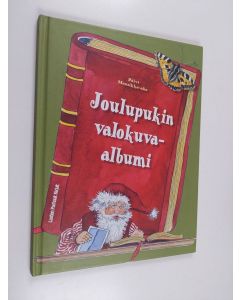 Kirjailijan Päivi Mansikka-Aho käytetty kirja Joulupukin valokuva-albumi