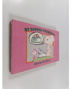 Kirjailijan Charles M. Schulz käytetty kirja By supper possessed