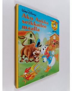 Kirjailijan Walt Disney käytetty kirja Aku Ankka seikkailee maalla