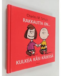 Kirjailijan Charles M Schulz käytetty kirja Rakkautta on... kulkea käsi kädessä