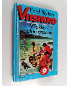 Kirjailijan Enid Blyton käytetty kirja Viisikko joutuu ansaan