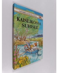 Kirjailijan Kenneth Grahame käytetty kirja Kaislikossa suhisee