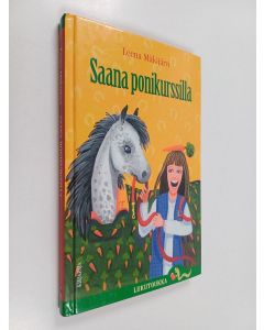 Kirjailijan Leena Mäkijärvi käytetty kirja Saana ponikurssilla
