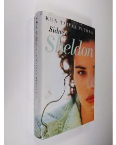 Kirjailijan Sidney Sheldon käytetty kirja Kun taivas putoaa
