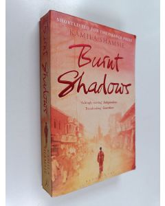 Kirjailijan Kamila Shamsie käytetty kirja Burnt Shadows