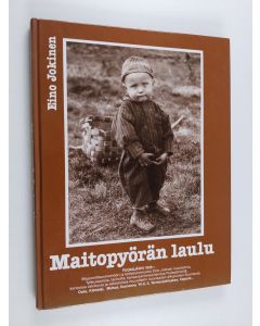 Kirjailijan Eino Jokinen käytetty kirja Maitopyörän laulu : muistelmia, työkuvauksia, kansanperinneaineistoa, piirroksia ja valokuvia Pudasjärveltä, Oulusta, Kiimingistä, Muhokselta, Yli-Iistä, Iistä ja Kuusamosta sekä matkakuvauksia Tornionjokilaaksosta 