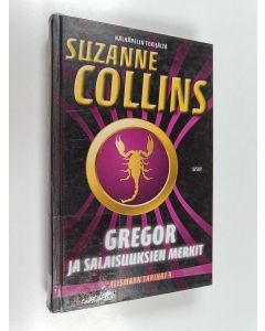 Kirjailijan Suzanne Collins käytetty kirja Gregor ja salaisuuksien merkit - Alismaan tarinat 4