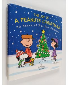 Kirjailijan Charles Monroe Schulz käytetty kirja The Joy of a Peanuts Christmas - 50 Years of Holiday Comics