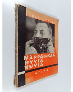 Kirjailijan Sakari Pälsi käytetty kirja Näppäilkää hyviä kuvia : käsivaraisen pikavalokuvauksen opas