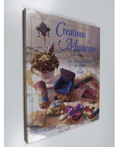Kirjailijan Eleanor Levie käytetty kirja Creations in miniature