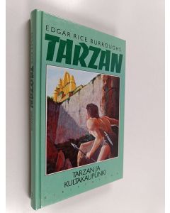 Kirjailijan Edgar Rice Burroughs käytetty kirja Tarzan ja kultakaupunki