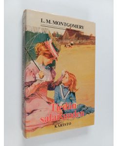 Kirjailijan L. M Montgomery käytetty kirja Tiedän salaisuuden