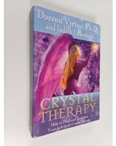Kirjailijan Doreen Virtue & Judith Lukomski käytetty kirja Crystal Therapy : How to Heal and Empower Your Life with Crystal Energy
