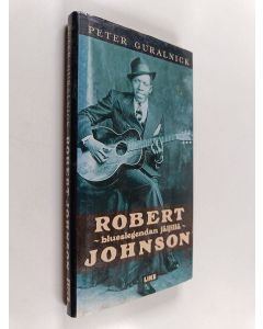 Kirjailijan Peter Guralnick käytetty kirja Robert Johnson : blueslegendan jäljillä